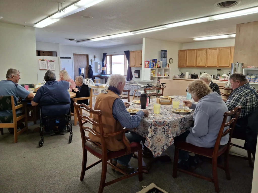 Seniors sharing a meal during adult day care services in Salida, Colorado